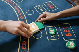 Live dealer table interface on bet2slot login showing card game in progress with player chat